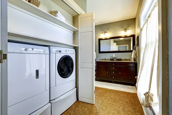 Light grey hallway with built-in washer and dryer — Stock Photo, Image