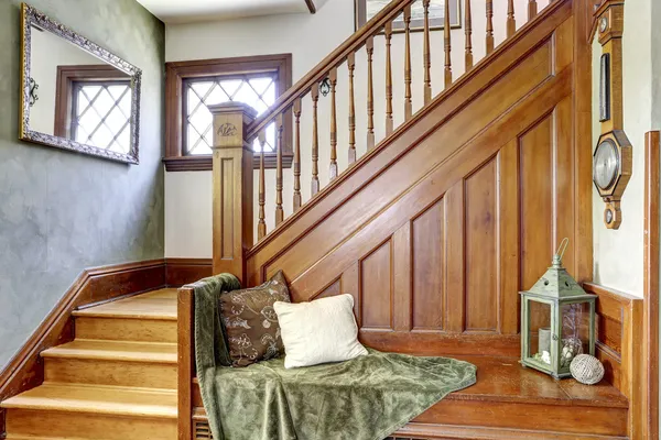 Wooden staircase with bench in old house — Stock Photo, Image