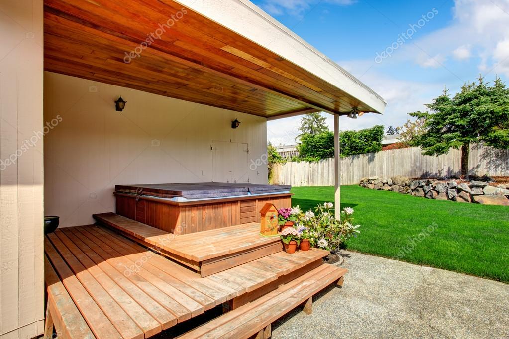 House exterior. Backyard deck with jacuzzi Stock Photo by ©iriana88w  49902855