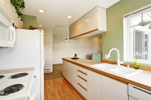 Simple mint kitchen interior in empty house — Stock Photo, Image