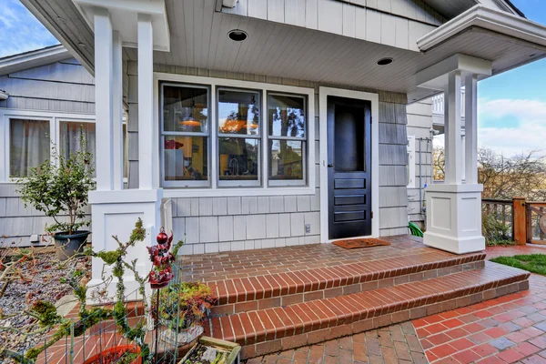 Entrance porch with black door — Stock Photo, Image