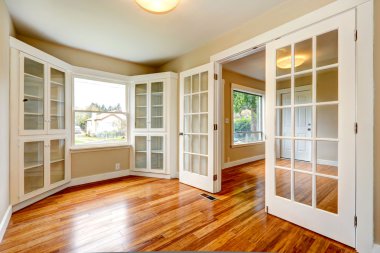 Empty house interior. View of entrance hallway and office room clipart