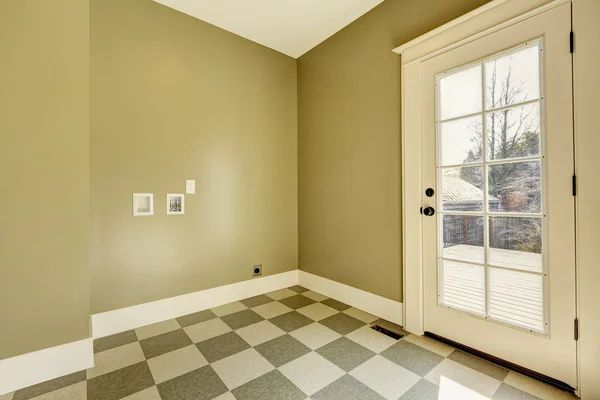 Empty entrance hallway with tile floor