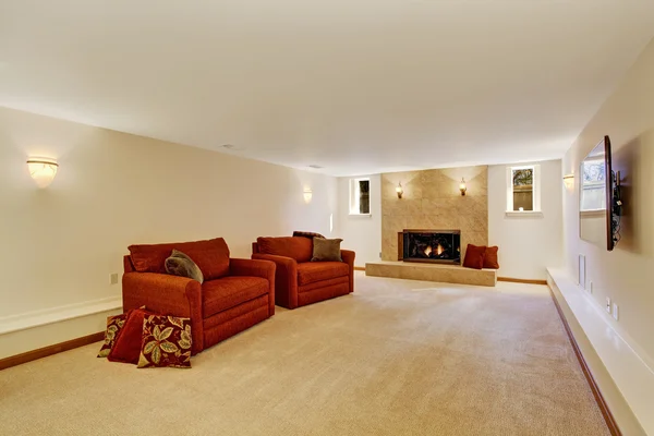 Living room with fireplace and red armchairs — Stock Photo, Image