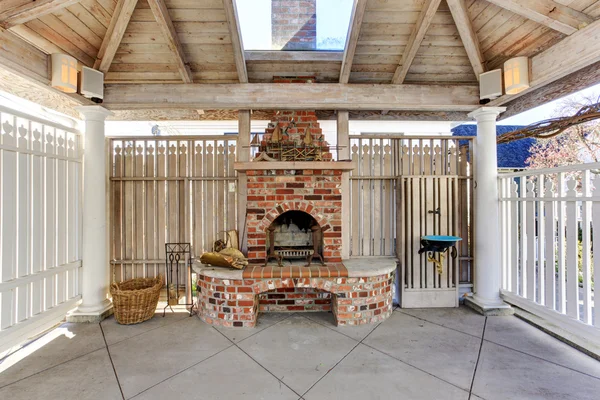 Pergola with brick fireplace on backyard — Stock Photo, Image
