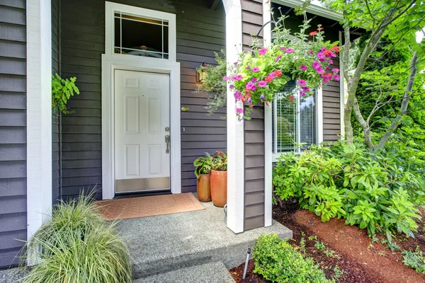 Entrance porch with blooming flowers — Stock Photo, Image