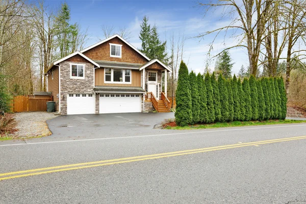 House exterior with stone wall trim — Stock Photo, Image