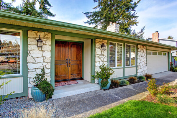 House exterior with stone wall trim