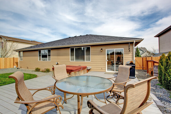 Walkout deck with patio area and jacuzzi