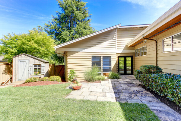 House exterior with walkout deck. Backyard view
