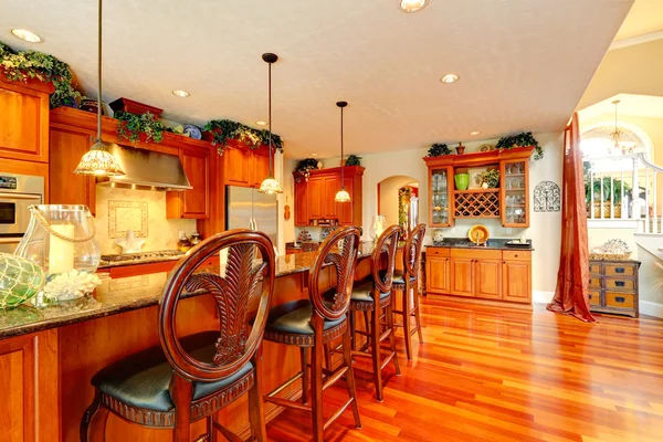 Luxury kitchen room with rich carved wood stools — Stock Photo, Image