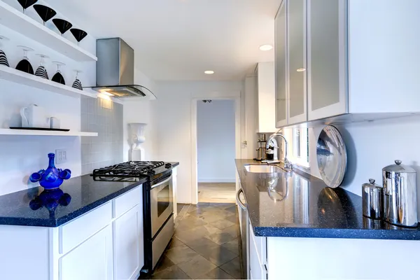 Kitchen interior with black granite tops — Stock Photo, Image