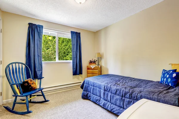 Bright ivory room with blue curtains and bed — Stock Photo, Image