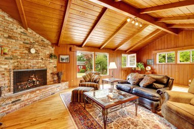 Luxury log cabin house interior. Living room with fireplace and  clipart