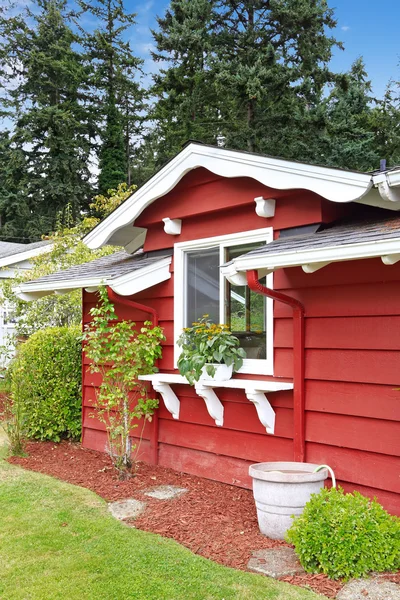 Bright red house wall with white window — Stock Photo, Image