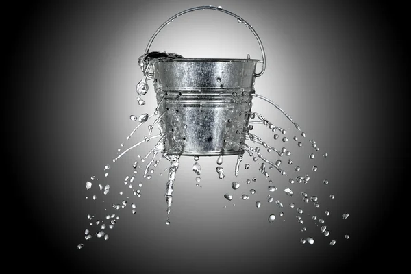 Bucket with holes Royalty Free Stock Images