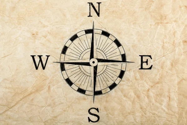 Kompas op gevouwen papier — Stockfoto