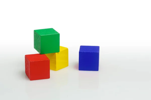 Four Colorful Wooden Cubes Isolated White — Stock Photo, Image