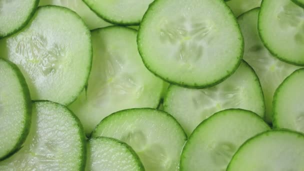 Closeup Freshly Cut Cucumber Slices Rotating — Stock video