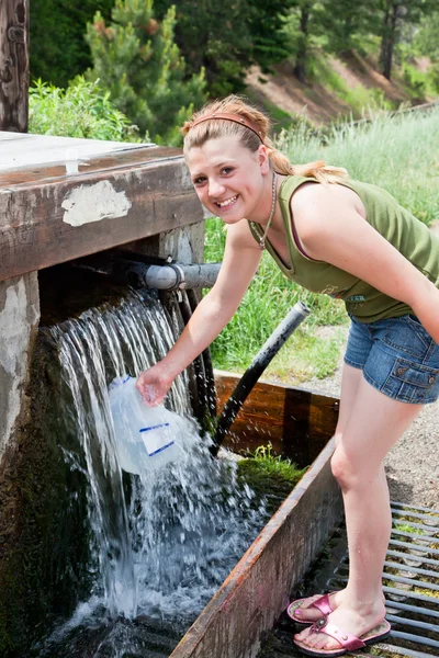 Girl Refilling a Water Jug — Stock Photo, Image