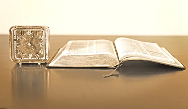 Bible and Alarm Clock on side