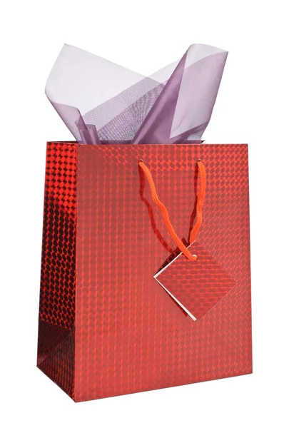 Red shopping bag with gift wrap — Stock Photo, Image