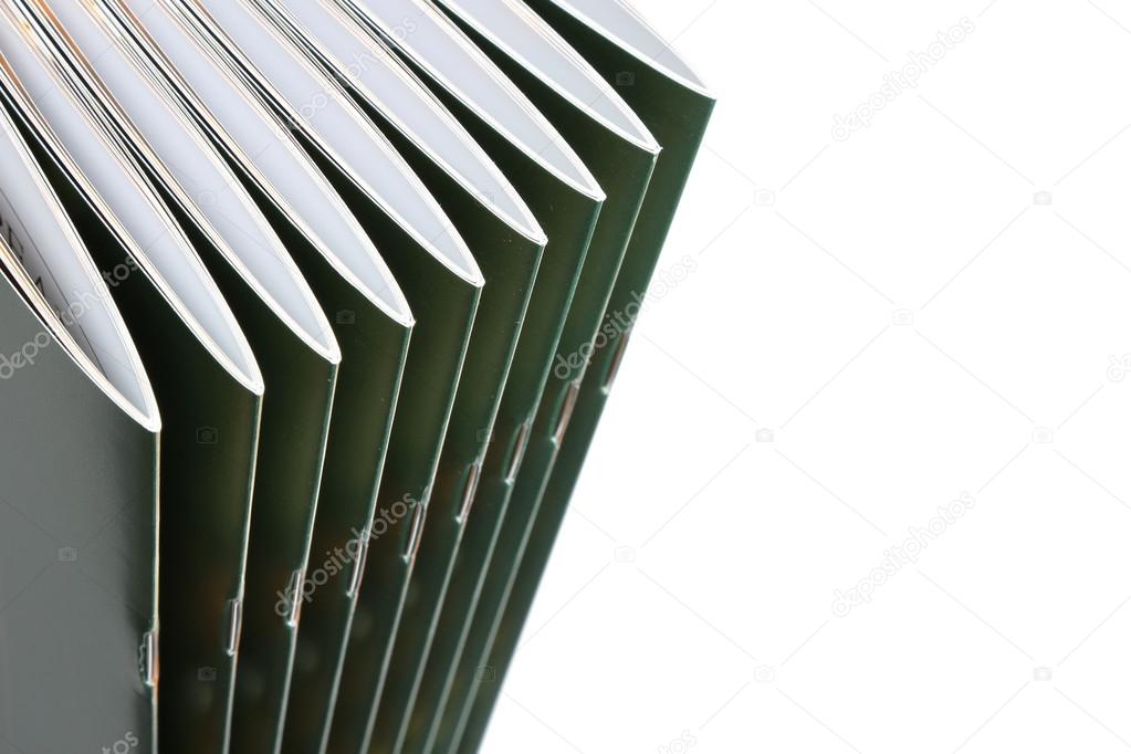 Stack of black covered magazines