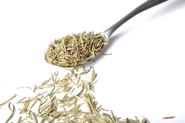 Whole rosemary leaves on spoon — Stock Photo, Image