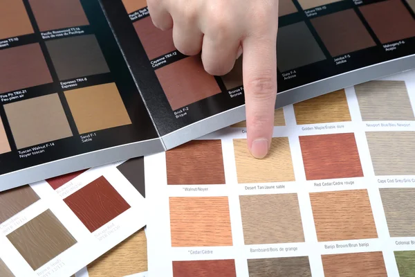 Hand pointing to sample color chart — Stock Photo, Image