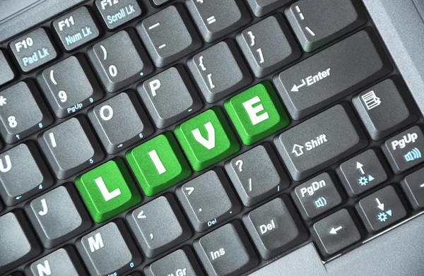 Live on keyboard — Zdjęcie stockowe