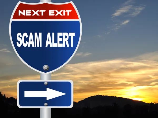 Scam alert road sign — Stock Photo, Image