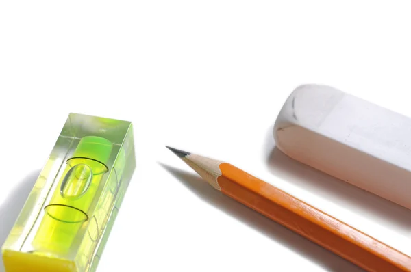 Pen, eraser and level — Stock Photo, Image