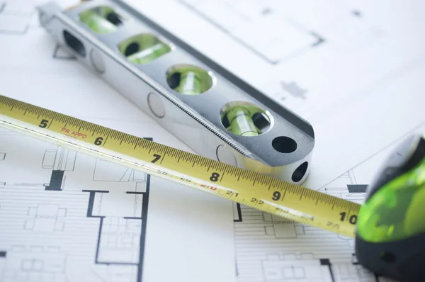 Architect floorplan with level and ruler — Stock Photo, Image