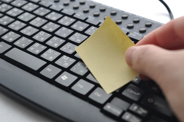 Putting memo on Chinese keyboard — Stock Photo, Image