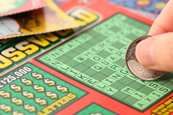 Scratching lottery tickets — Stock Photo, Image