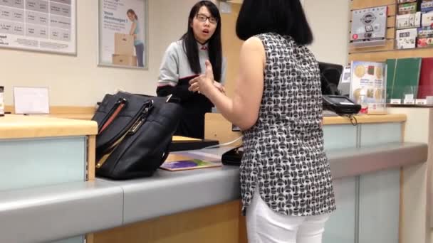 Woman mailing letter at post office — Stock Video