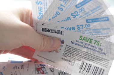 Holding saving coupons clipart