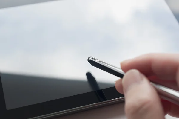 Close-up of woman working with stylus on digital tablet pc — Stock Photo, Image