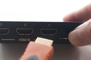 Plug in HDMI cable of device  clipart