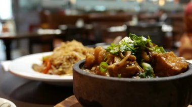 One side of the dan pot with heavy smoke inside a Chinese restaurant with 4k resolution.