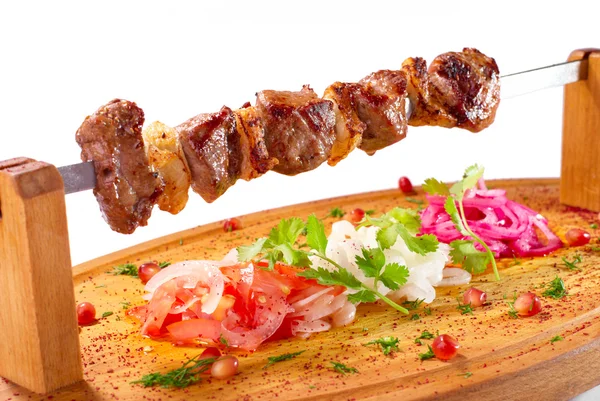 Shish kebab on a wooden stand — Stock Photo, Image