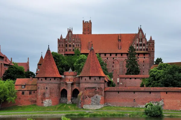 Malbork castle, felhős napon, Lengyelország Stock Kép