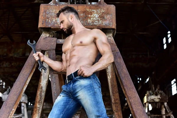 Bearded Man Naked Torso Jeans Looks Adjustable Wrench Holds His — Stock Photo, Image