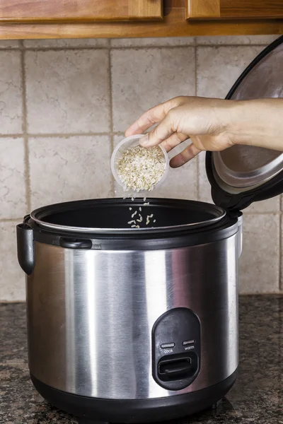 Preparing rice in cooker — Stock Photo, Image