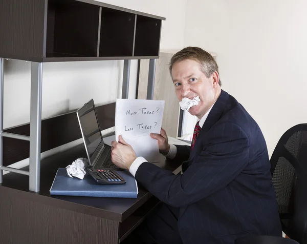 Mature Man Biting Income Tax Papers — Stock Photo, Image