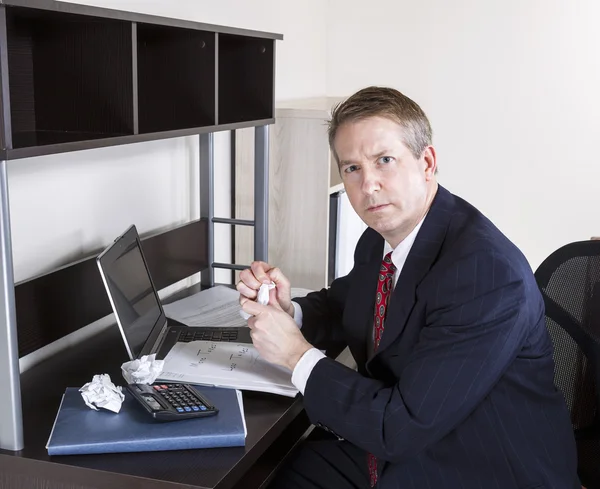 Mature Man not happy working on Personal Income Taxes — Stock Photo, Image