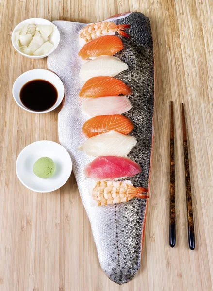 Sushi on Large Salmon Fillet serving as plate — Stock Photo, Image