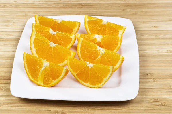 Sliced Fresh Oranges on White Plate — Stock Photo, Image