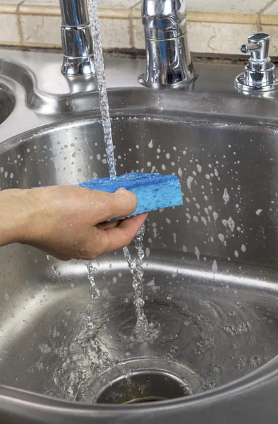 Rinsing Soap off of sponge — Stock Photo, Image