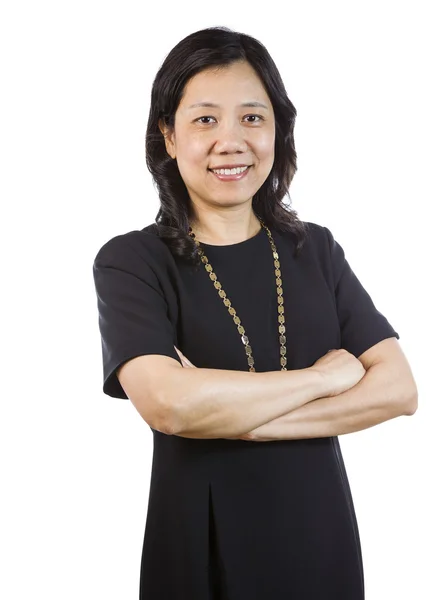 Mature Asian Woman in Business attire standing relaxed — Stock Photo, Image